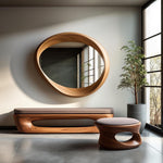May include: A modern interior scene featuring a large, oval-shaped wooden mirror. Below the mirror is a wooden bench with a gray cushion, and a matching stool. A potted plant sits near a large window, and the floor is gray tile.