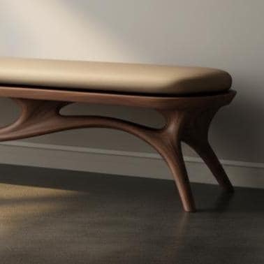 May include: A modern wooden bench with a light brown, cushioned seat. The bench has a dark brown, organically shaped base with curved legs. The bench is set against a neutral wall and floor.
