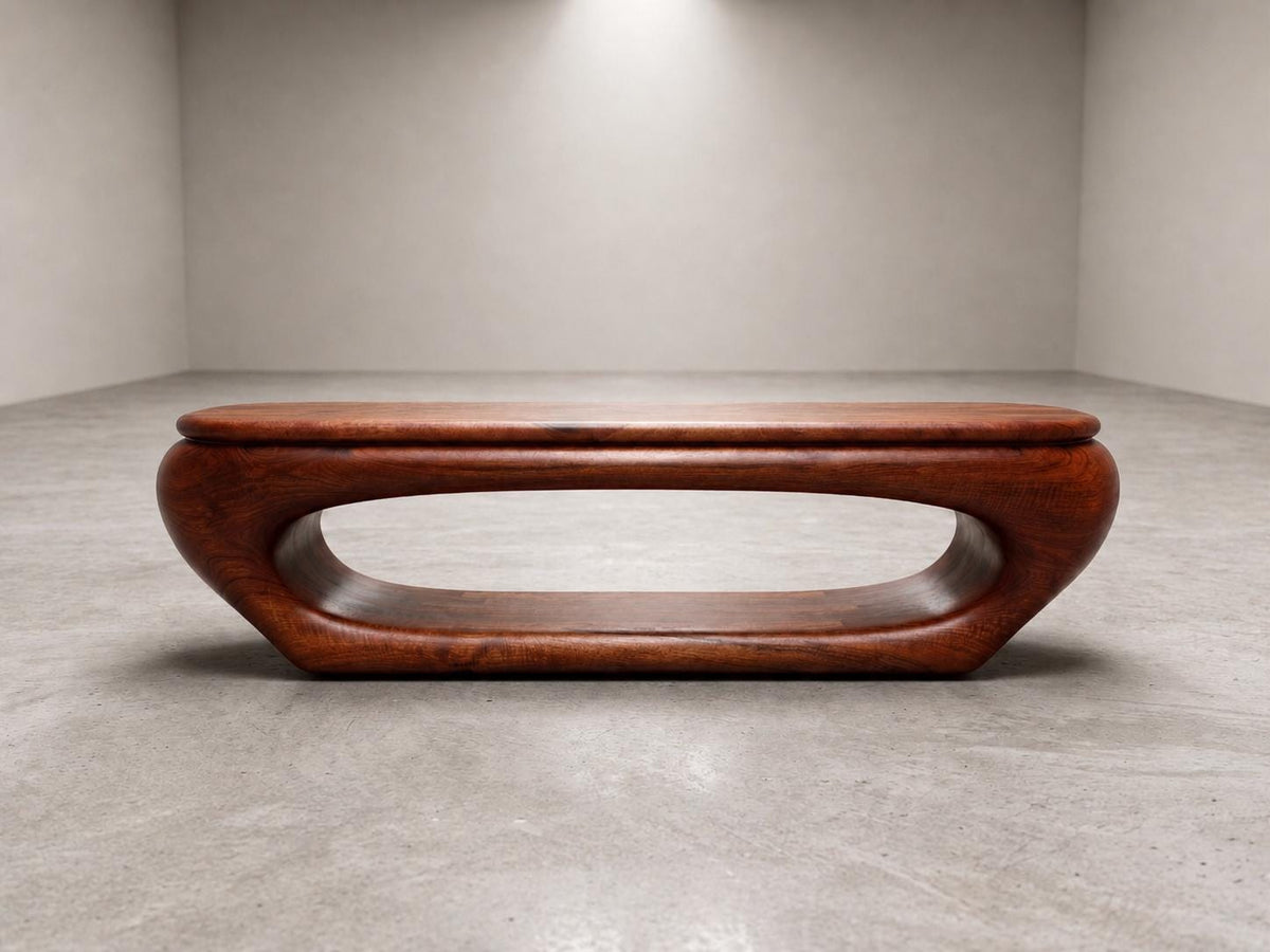 May include: A mid-century modern coffee table with a rich, reddish-brown finish. The table features a unique, oval-shaped design with a hollowed-out center. The table is approximately 48 inches long and 16 inches high.