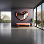 May include: A heart-shaped wall mirror with a smooth wooden frame mounted above a low wooden bench featuring a soft pink upholstered seat. The bench has a rounded, hollow base design, and a small potted green plant sits beside it.